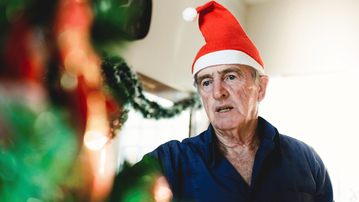 Alone old man at Christmas. You Can Make a Difference; Nominate Someone For A Free Christmas Tree!