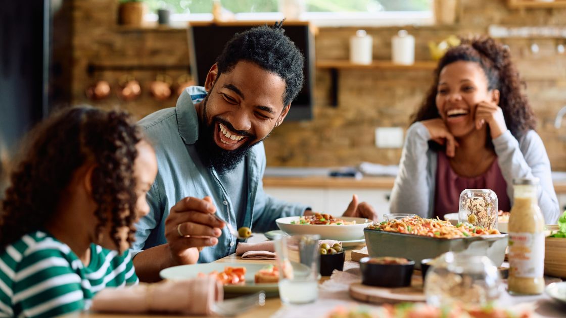 A nostalgic image of a parent looking through photos of their child growing up, with a collage of baby pictures to recent moments visible on a tablet screen. Emotional Benefits of Storytelling - Every Photo Deserves a Story